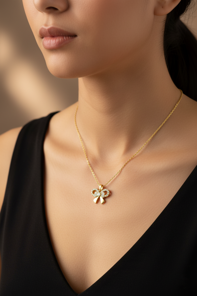 Stainless Steel Crystal Bow Pendant Necklace – Gold