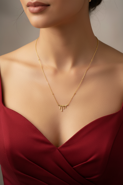 Stainless Steel Flowing Pendant Necklace with Beaded Chain – Gold