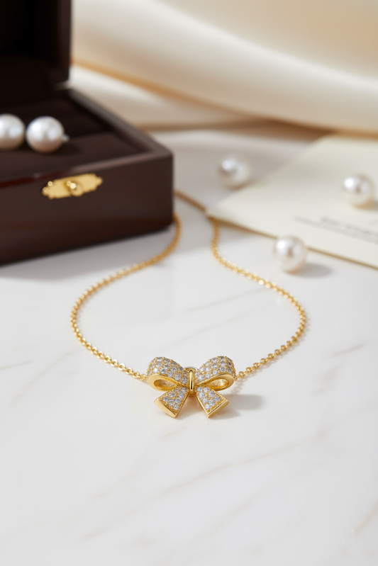 Stainless Steel Crystal Bow Pendant Necklace – Gold
